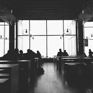 group of people sitting inside the building thumbnail
