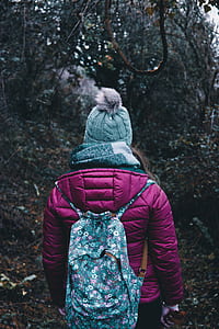 girl wearing coat and blue backpack thumbnail