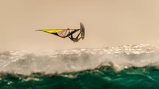 person riding on wind surfing with big waves thumbnail