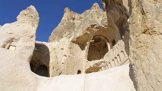brown stone structure under blue clear sky during daytime thumbnail