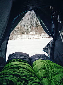 two black-and-green sleeping bags inside tent thumbnail