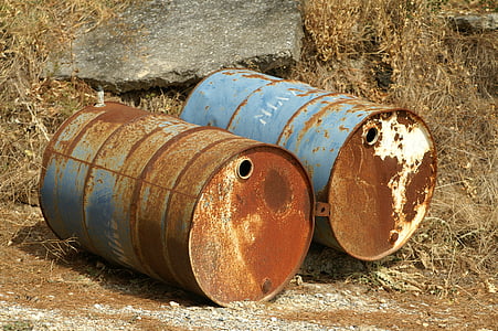 two blue-and-brown metal drums on brown surface thumbnail