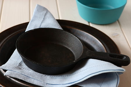 black frying pan on gray textile thumbnail