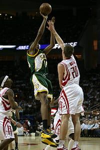 four basketball players on court thumbnail