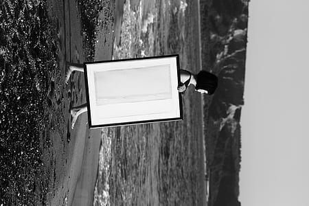 grayscale photo of holding wood panel thumbnail
