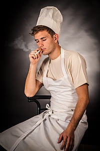man in white apron smoking cigarette thumbnail