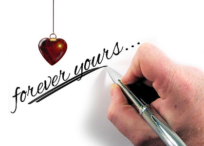 person writing forever yours on wall thumbnail