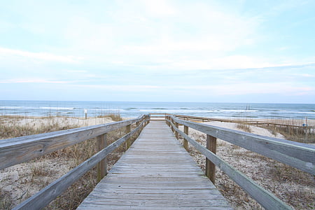 wooden dock under cloudy sky thumbnail