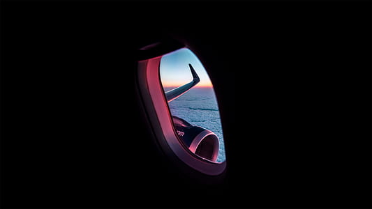 person taking photo of airplane window thumbnail