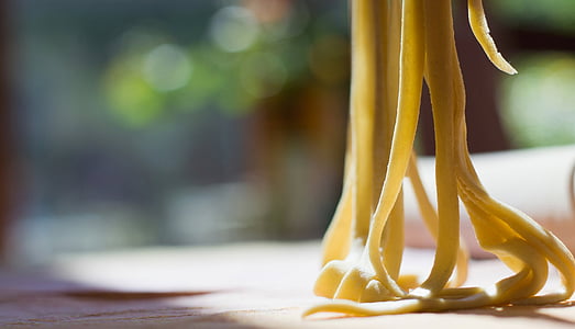 shallow focus photography of yellow pasta thumbnail