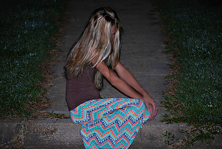 woman sitting on pavement thumbnail