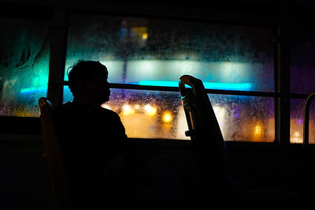 man sitting inside bus thumbnail