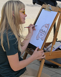 girl sketching white sitting in front of easel thumbnail