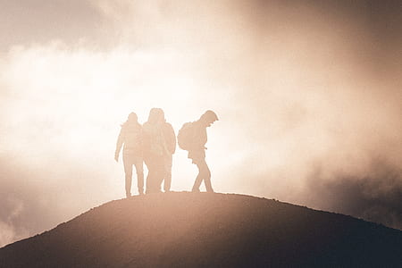 silhouette of hikers on top of mountain with fogs thumbnail
