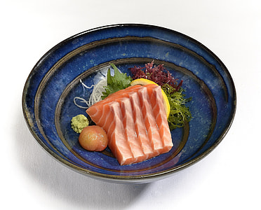 sliced raw tuna in blue bowl thumbnail