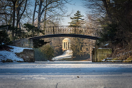 black metal bridge and brown concrete gazebo thumbnail