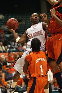 basketball player holding ball thumbnail