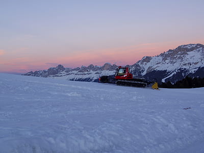 red heavy equipment on snow plain thumbnail