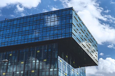 Glass office building captured against a blue sky thumbnail