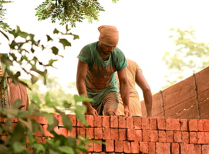man building brick wall thumbnail