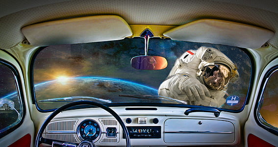 view of an astronaut and earth from inside a vehicle thumbnail