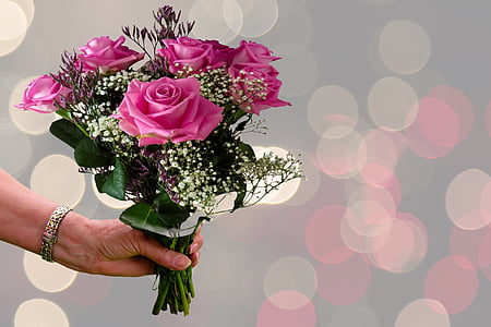person's holding pink rose bouquet thumbnail