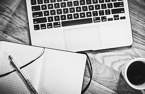 grayscale photo of MacBook near ceramic mug thumbnail