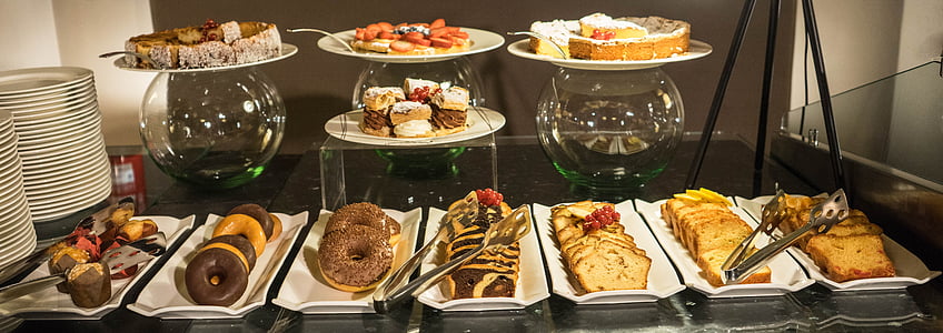 varieties of food on plates and trays on display thumbnail