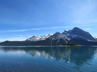 mountain near body of water during daytime thumbnail