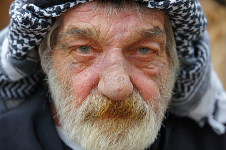 man in white and black headdress thumbnail