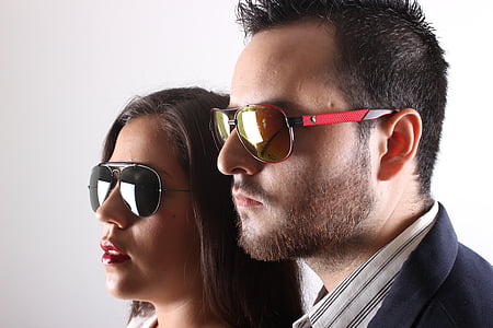 man and woman wearing aviator-style sunglasses thumbnail