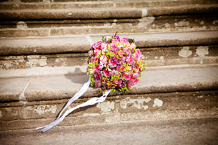 pink and yellow petaled flowers bouquet in the stairs thumbnail