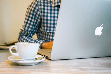 person using grey MacBook thumbnail