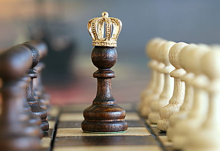shallow photography of chess pawn with crown thumbnail