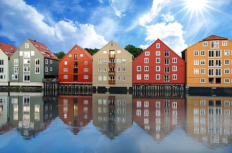 assorted-color buildings under blue sky thumbnail