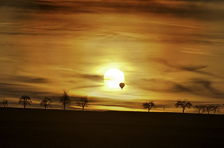 hot air balloon at sky durinbg sun set thumbnail