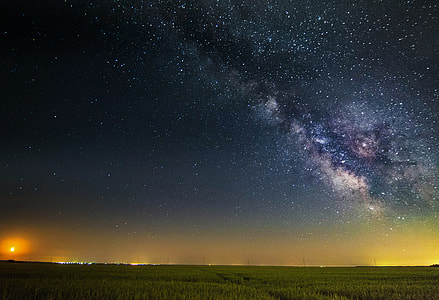 green grass field under starry night thumbnail