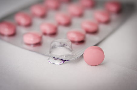 selective focus photography of pink medication pill thumbnail