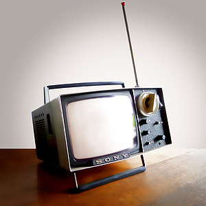 vintage gray Sony CRT TV on brown surface thumbnail