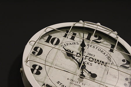 round white analog clock at 10: 58 thumbnail