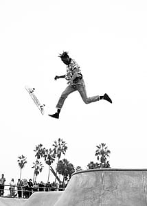 grayscale photo of man doing skateboard tricks thumbnail