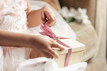 Young Girl Opening Gift Photo thumbnail