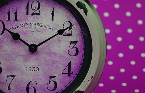 round black, purple, and white analog wall clock pointing at 1:50 thumbnail