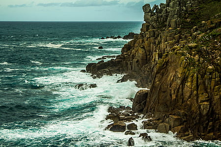 bird's-eye photography of mountains with splash of waters thumbnail