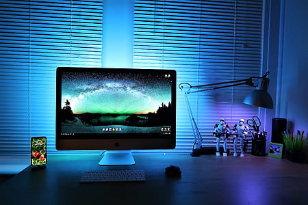 silver iMac beside space gray iPhone X thumbnail