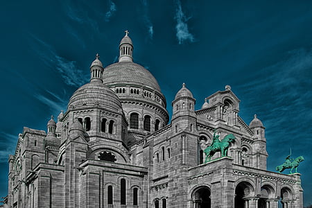 gray concrete chapel under blue sky thumbnail