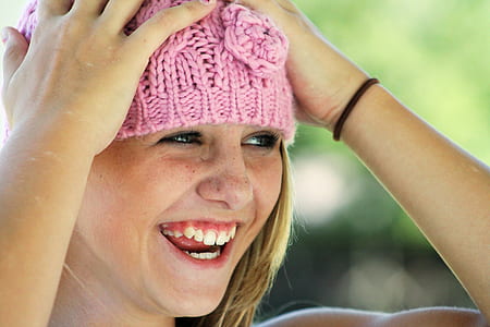 woman wearing pink beanie hat thumbnail