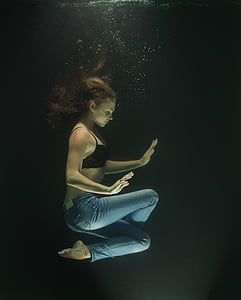 woman meditating underwater thumbnail