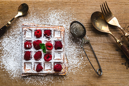 Breakfast waffles with fresh raspberries and powdered sugar thumbnail
