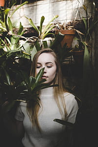 woman surrounded by plants thumbnail